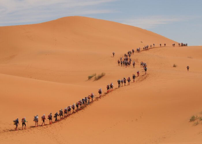 A long file of competitors take the start of the 24th Marathon des Sables in the Sahara desert, on March 30, 2009 climbing the first dunes of Merzouga, some 300 kilometres south of Ouarzazate in Morocco, a day late due to heavy rain last week. The first stage was cancelled and the route modified. AFP PHOTO PIERRE VERDY (Photo credit should read PIERRE VERDY/AFP/Getty Images)